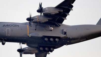 Tom Cruise hangs from the side of a flying plane for ‘Mission: Impossible 5’ stunt